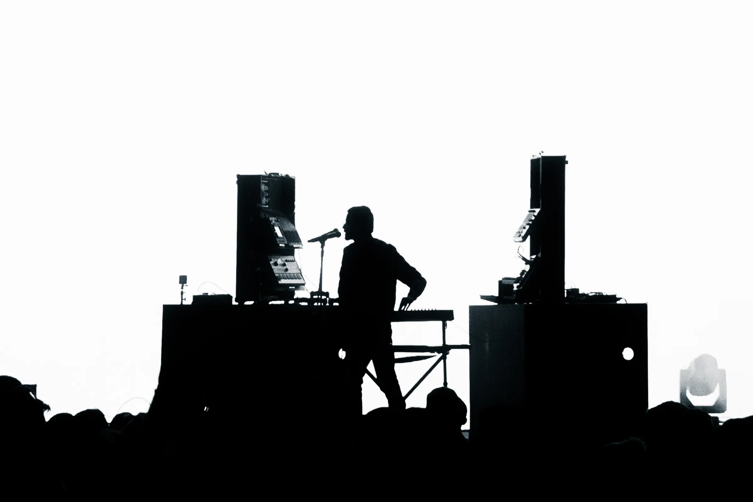 Sapta on stage, silhouetted at the rig